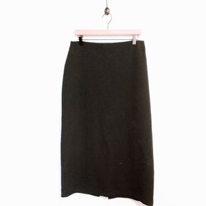 Option size 10 black midi skirt, gives off witchy goth vibes.  Has a small rip i